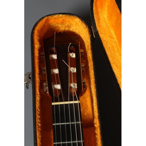 649 - A JAPANESE CLASSICAL GUITAR by Hiroshi Tamura, with red and black stained inlaid sound hole, the mac... 