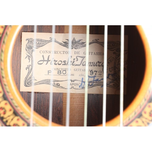 649 - A JAPANESE CLASSICAL GUITAR by Hiroshi Tamura, with red and black stained inlaid sound hole, the mac... 