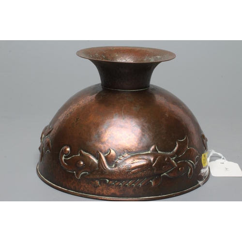 655 - A NEWLYN COPPER PEDESTAL BOWL, early 20th century, hammered with a band of three scaly fish on a pla... 