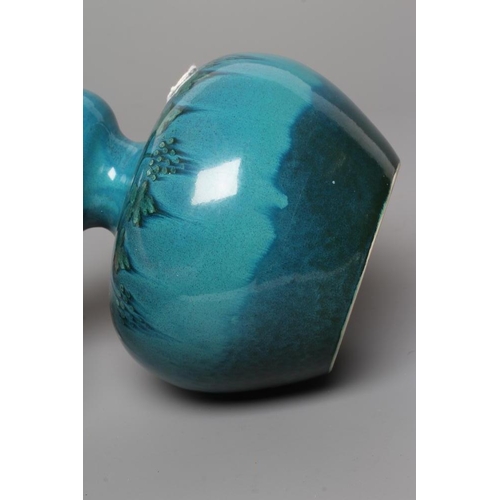 66 - A RUSKIN VASE, early 20th century, of globular form with garlic type neck, the streaky blue souffle ... 