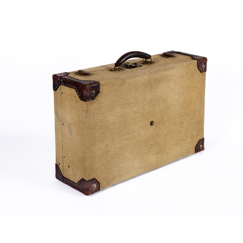 660 - AN HERMES CANVAS AND LEATHER SUITCASE, early 20th century, with stitched and rivetted leather angles... 