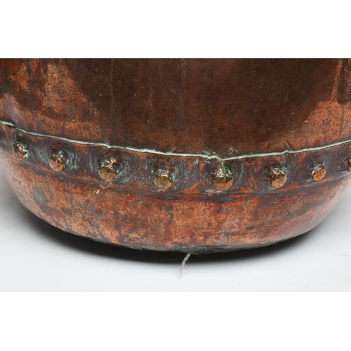 673 - A COPPER LOG BIN, early 20th century, of cylindrical form with moulded rim, riveted seams and brass ... 