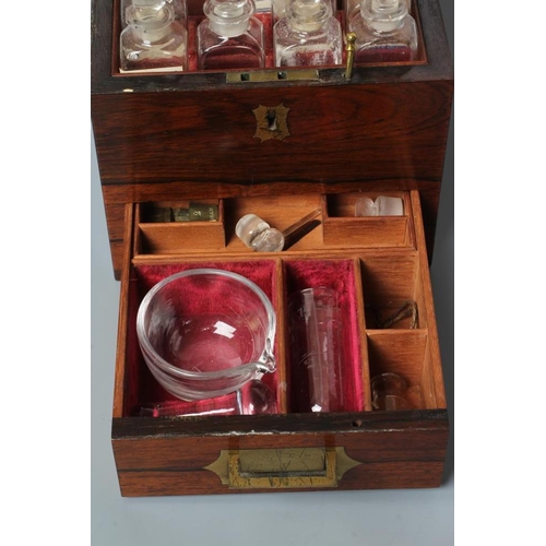 691 - AN APOTHECARY'S ROSEWOOD MEDICINE CHEST, early 19th century, of square form with brass campaign hand... 