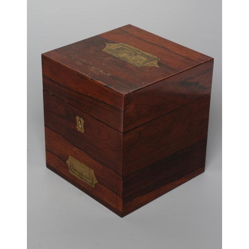 691 - AN APOTHECARY'S ROSEWOOD MEDICINE CHEST, early 19th century, of square form with brass campaign hand... 