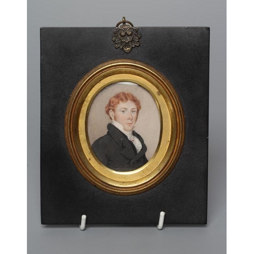 717 - ENGLISH SCHOOL (Early 19th Century) A Gentleman in a black frock coat, oval miniature on ivory, unsi... 