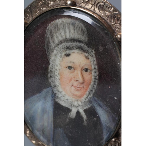 721 - ENGLISH SCHOOL (19th century) Portrait of a Woman in a lace bonnet, oval miniature on ivory with hai... 