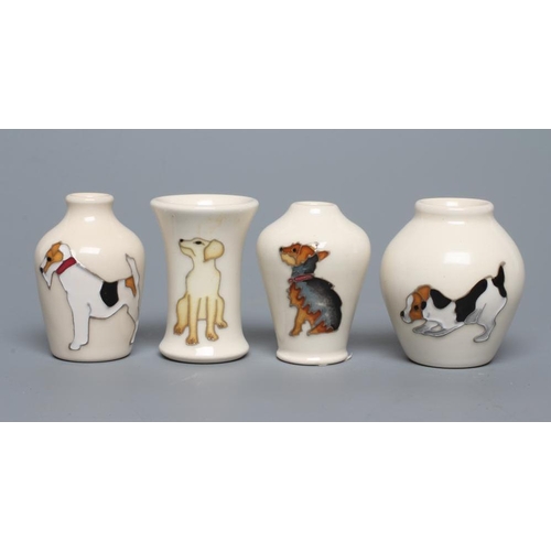 81 - FOUR MINIATURE MOORCROFT POTTERY DOG VASES, comprising Yorkshire Terrier, Jack Russell and Labrador,... 