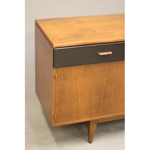 863 - A RETRO TEAK SIDEBOARD, the moulded edged top over three black leatherette frieze drawers with gilt ... 