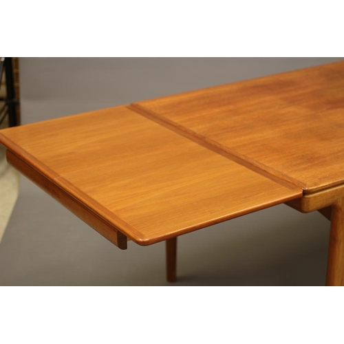 866 - JOHANNES ANDERSEN, A DANISH TEAK EXTENDING DINING TABLE, the moulded edged rounded oblong top with p... 