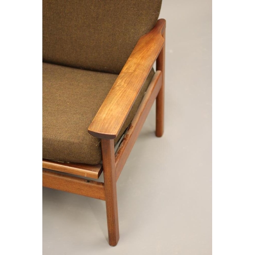 870 - A RETRO TEAK FRAMED LOUNGE CHAIR with loose cushions in brown tweed, shaped arms, on rounded square ... 