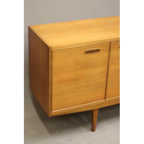 882 - A RETRO TEAK LONG SIDEBOARD of Scandinavian design, the fascia with four drawers with inset oval woo... 