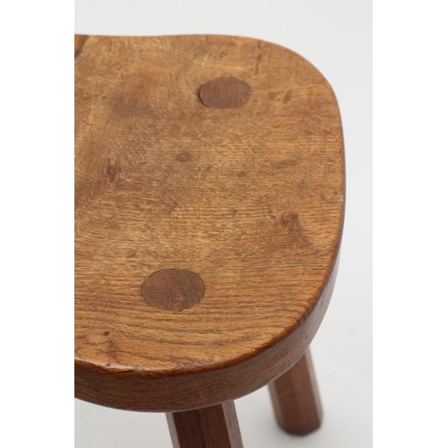 883 - A ROBERT THOMPSON OAK STOOL, the saddle seat with carved mouse trademark in high relief to the edge,... 