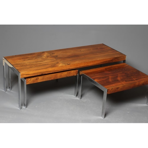 884 - A NEST OF ROSEWOOD COFFEE TABLES, mid 20th century, of oblong form on square section chrome plated l... 