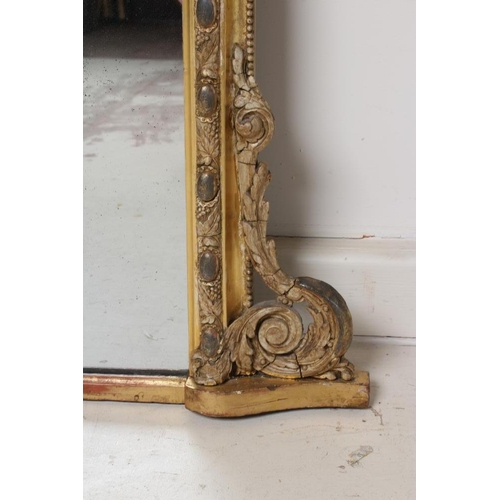 895 - A VICTORIAN GILT GESSO OVERMANTEL MIRROR, the arched plate within a moulded frame with cabochons ami... 