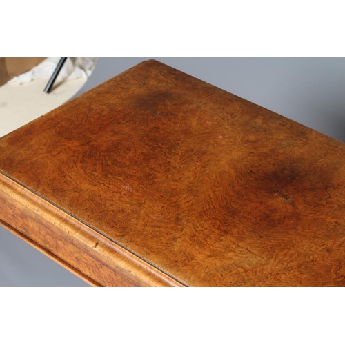 898 - A VICTORIAN BURR WALNUT FOLDING CARD TABLE, the moulded edged rounded oblong top opening to interior... 