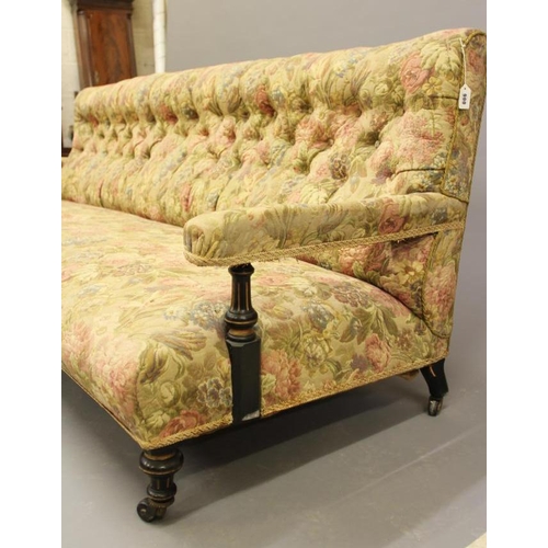 900 - AN AESTHETIC EBONISED AND PARCEL GILT CLUB SETTEE, late 19th century, button upholstered in a floral... 