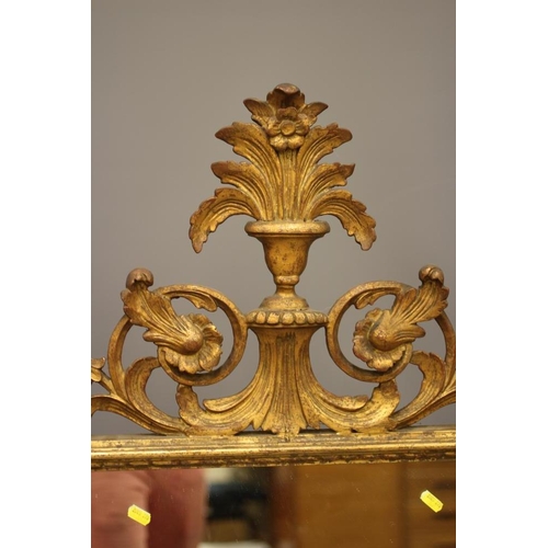 901 - A GEORGIAN STYLE CARVED GILTWOOD PIER GLASS, 20th century, the oblong plate within a beaded frame, t... 