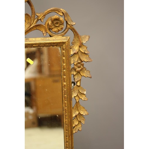 901 - A GEORGIAN STYLE CARVED GILTWOOD PIER GLASS, 20th century, the oblong plate within a beaded frame, t... 