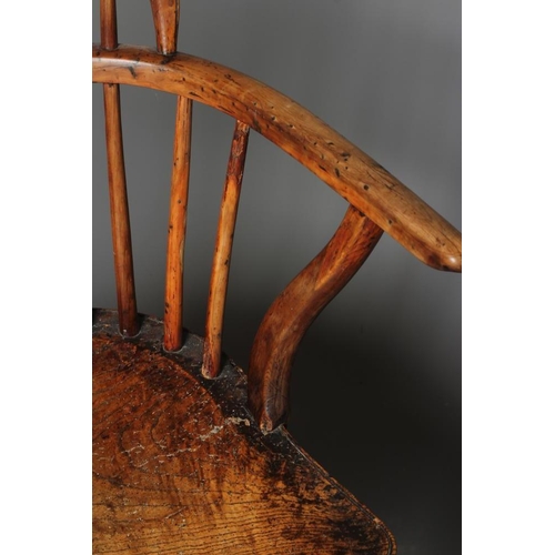 912 - A YEW AND ELM WINDSOR ARMCHAIR, 19th century, of low hoop back form with pierced fleur de lys splat,... 