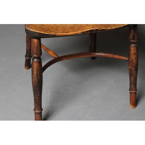 912 - A YEW AND ELM WINDSOR ARMCHAIR, 19th century, of low hoop back form with pierced fleur de lys splat,... 