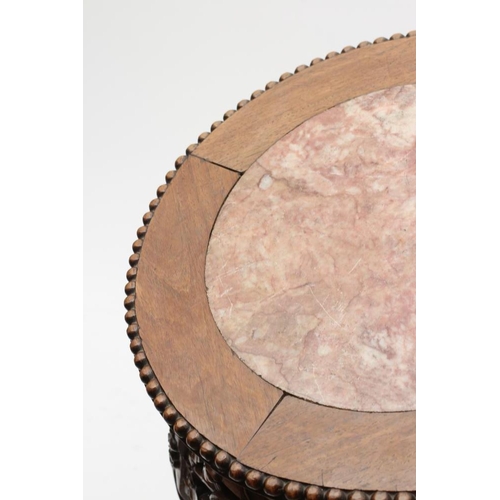 919 - A CHINESE PADOUK WOOD STAND, c.1900, the beaded edged circular top inset with rouge marble, arched f... 