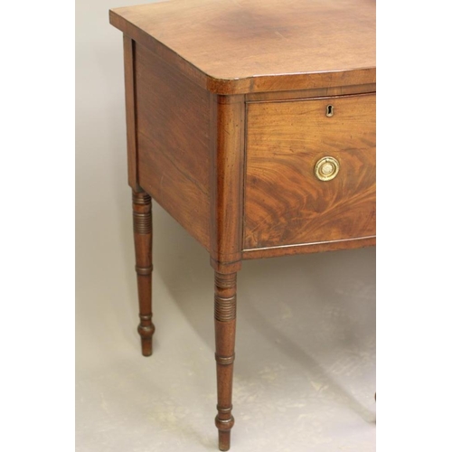 924 - A REGENCY MAHOGANY SIDEBOARD, early 19th century, of bowed form with ebony stringing, frieze drawer ... 