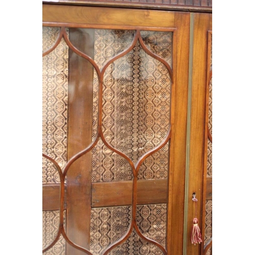 927 - A MAHOGANY DISPLAY CABINET, 18th century on later stand, the dentil moulded cornice over blind fret ... 