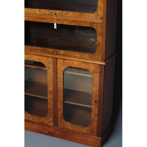 934 - A VICTORIAN BURR WALNUT BOOKCASE, the moulded edged top with raised superstructure containing two sm... 