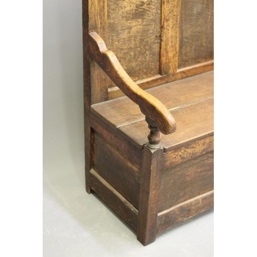 935 - A GEORGIAN OAK BOX SETTLE, early 19th century and later, the high triple panelled back with scrolled... 