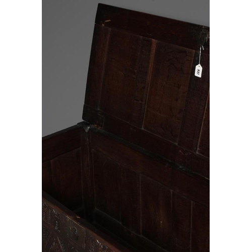 938 - AN OAK PANELLED COFFER, 18th century, the panelled lid opening to a void interior, the four panelled... 