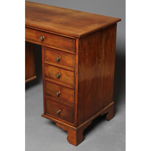 939 - A MAHOGANY KNEEHOLE DESK, early to mid 19th century, the reeded edged top over two frieze and eight ... 