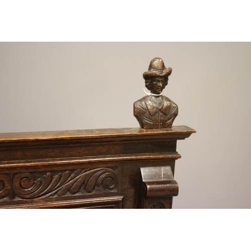 942 - A VICTORIAN CARVED OAK BOX SETTLE, the triple panelled back depicting figure scenes in high relief b... 