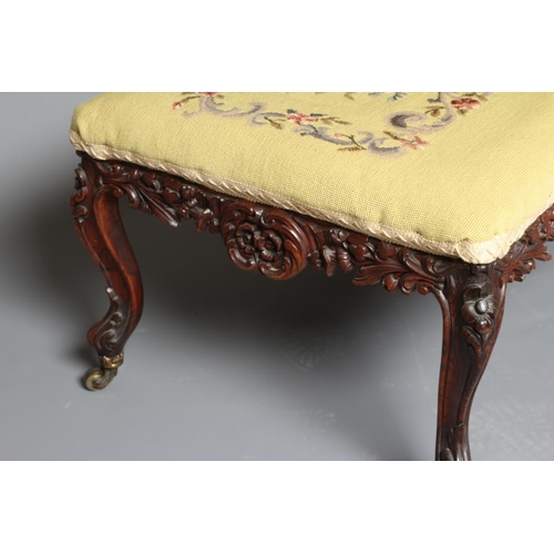 944 - A VICTORIAN DRESSING STOOL of oblong form in rosewood and mahogany, the seat upholstered in gros poi... 