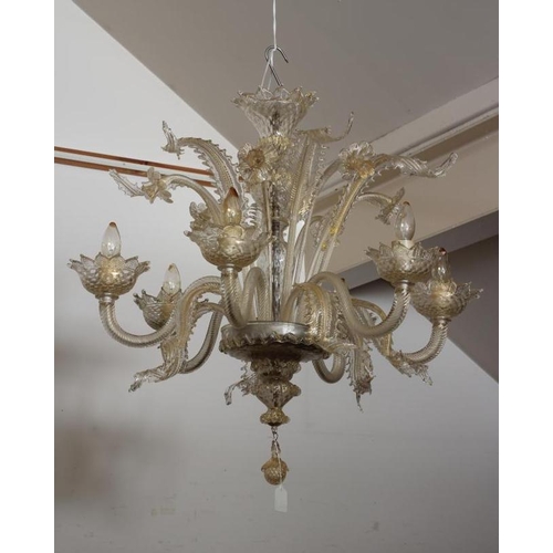 948 - A VENETIAN SIX LIGHT CLEAR GLASS CHANDELIER, early 20th century, the baluster stem with upturned cor... 