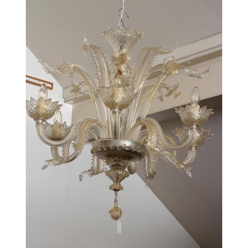 948 - A VENETIAN SIX LIGHT CLEAR GLASS CHANDELIER, early 20th century, the baluster stem with upturned cor... 