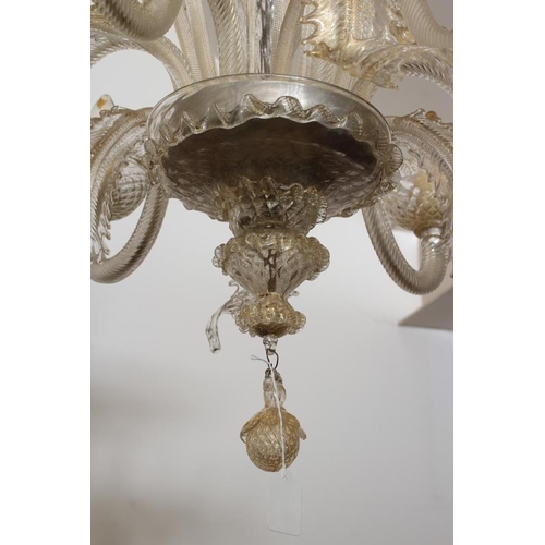 948 - A VENETIAN SIX LIGHT CLEAR GLASS CHANDELIER, early 20th century, the baluster stem with upturned cor... 