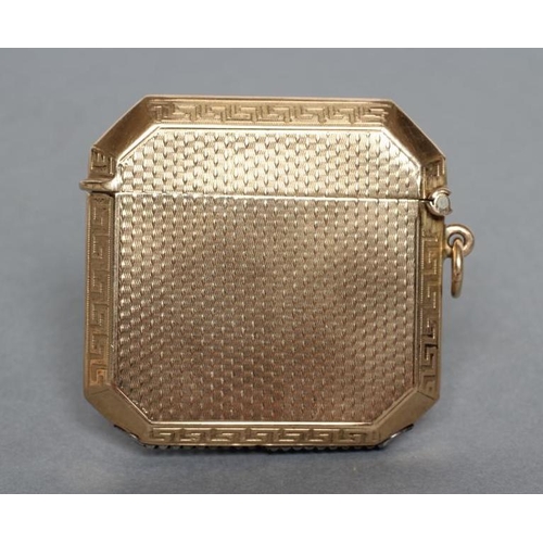 155 - A 9CT GOLD VESTA CASE, maker J.H. Wilkinson, Birmingham 1926, of canted square section, with engine ... 