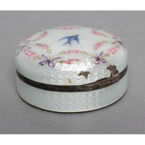 169 - AN ENAMEL BOX AND COVER, stamped 935, of circular form painted with a bluebird within a ribbon tied ... 