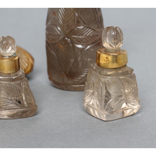 190 - A BANDED AGATE PERFUME BOTTLE AND STOPPER carved and polished in low relief with palm fronds, 3 1/4