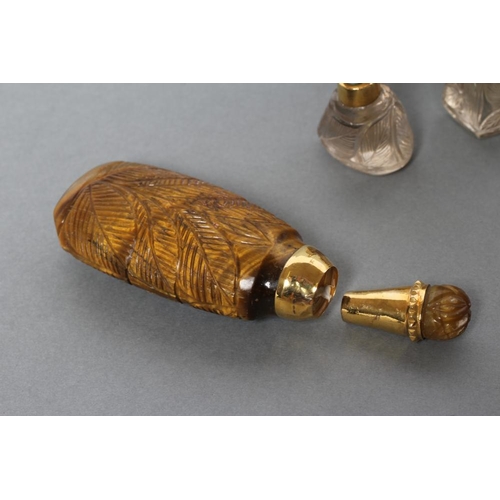 190 - A BANDED AGATE PERFUME BOTTLE AND STOPPER carved and polished in low relief with palm fronds, 3 1/4