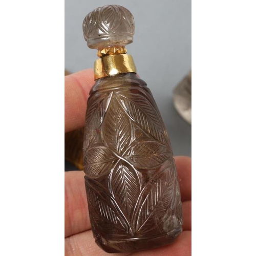 190 - A BANDED AGATE PERFUME BOTTLE AND STOPPER carved and polished in low relief with palm fronds, 3 1/4