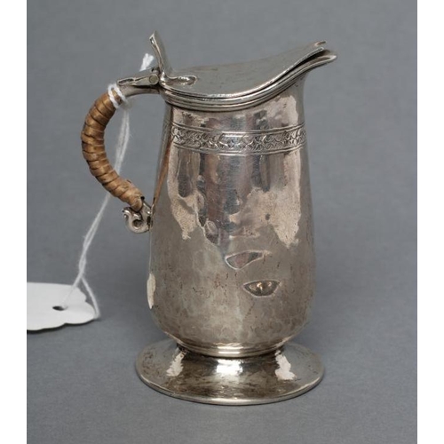 192 - A MINIATURE SILVER JUG, maker Liberty & Co., Birmingham 1920, of tapering rounded cylindrical form w... 