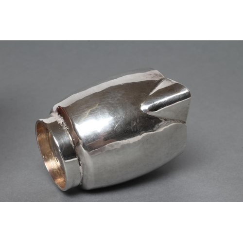 193 - A SMALL SILVER JUG, maker Nancy Goodman, London 1975, of planished slightly bombe cylindrical form w... 