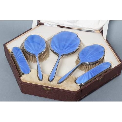 204 - AN ART DECO SILVER SIX PIECE DRESSING TABLE SET, maker possibly A. Clark, Birmingham 1931, with sky ... 