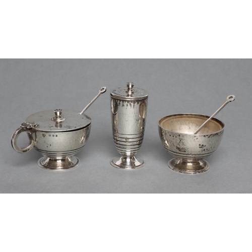 206 - AN ART DECO SILVER THREE PIECE CRUET, maker Charles Boyton & Son, of lightly planished plain U form ... 