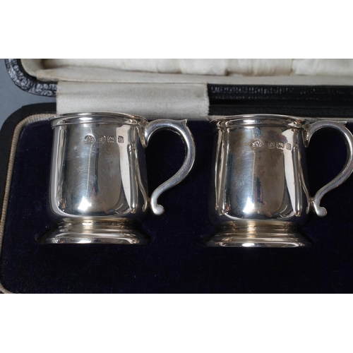 208 - A SET OF SIX MINIATURE SILVER MUGS, maker Adie Bros., Birmingham 1926, of plain baluster form with s... 