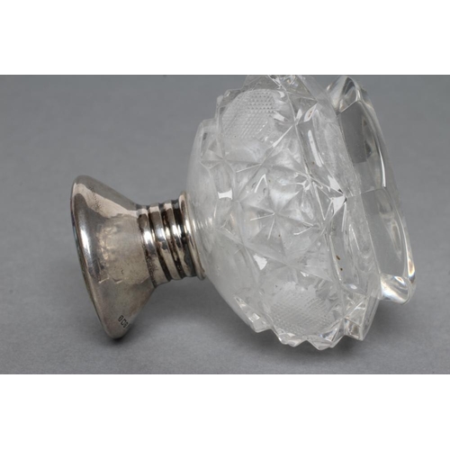 233 - AN ART DECO GLASS SCENT BOTTLE of spherical form with slice and strawberry cut panels, with screw-on... 