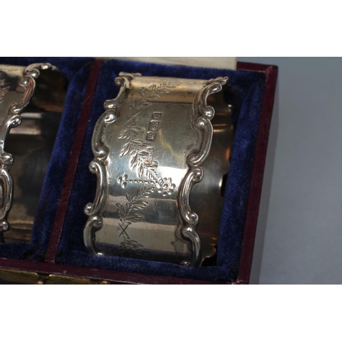 249 - A PAIR OF GEORGE V SILVER NAPKIN RINGS, maker's mark PFM (script), Sheffield 1912, of oval form with... 