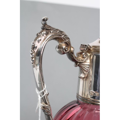 279 - A SILVER MOUNTED CRANBERRY GLASS CLARET JUG, maker's mark WW, London 2001, the lightly ribbed ovoid ... 