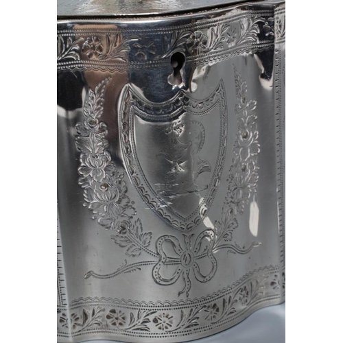 311 - A GEORGE III SILVER TEA CADDY, maker Henry Chawner, London 1788, of serpentine form, the flat hinged... 